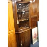 A REPRODUCTION MAHOGANY GLAZED CORNER CABINET