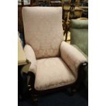 AN ANTIQUE MAHOGANY FRAMED SCROLL ARM ARMCHAIR