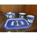 A WEDGWOOD JASPERWARE BLUE DIP THREE PIECE TEA SERVICE & ANOTHER BLUE DIP TRAY (4)