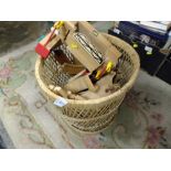 A BASKET OF WOODEN BRIO TRAIN TOYS