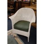 AN ORIGINAL LLOYD LOOM ARMCHAIR WITH UPHOLSTERED SEAT CUSHION