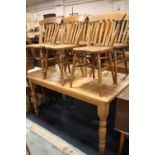 A HONEY PINE KITCHEN TABLE' H-78 CM W-92 CM L-153 CM TOGETHER WITH SIX TRADITIONAL STYLE SLAT BACK