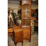 A WALNUT POT CUPBOARD AND A CORNER CABINET (2)