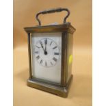 AN ANTIQUE FRENCH BRASS CARRIAGE CLOCK