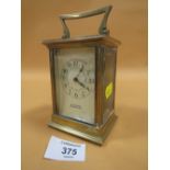 AN ANTIQUE FRENCH BRASS CARRIAGE CLOCK