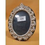 A HALLMARKED SILVER MOUNTED PICTURE FRAME