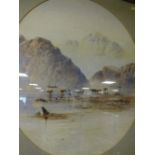 E.L. HERRING - A FRAMED AND GLAZED WATERCOLOUR DEPICTING A FIGURE WITH CATTLE IN A MOUNTAINOUS