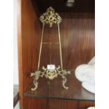 A LARGE EDWARDIAN BRASS PICTURE EASEL