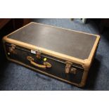 A VINTAGE BANDED SUITCASE
