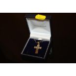 A 9CT GOLD CELTIC STYLE CROSS PENDANT ON CHAIN