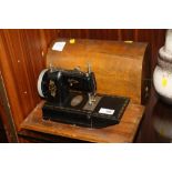 A VINTAGE VULCAN CASED SEWING MACHINE