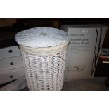 A BOXED GOOSE FEATHER AND DOWN DUVET TOGETHER WITH A WICKER LAUNDRY BASKET