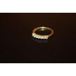 A 9CT GOLD SEVEN STONE DIAMOND RING - SIZE P - WEIGHT 1.8 GRAMS APPROX