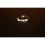 A HALLMARKED 9 CARAT GOLD SEVEN STONE DRESS RING - SIZE N - WEIGHT 1.7 GRAMS APPROX