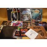A COLLECTION OF ACDC LP RECORDS AND SINGLES TO INCLUDE BACK IN BLACK, HIGH VOLTAGE, LET THERE BE