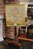 AN ANTIQUE MAHOGANY POLE SCREEN WITH LATER TAPESTRY SCREEN