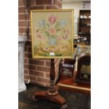 AN ANTIQUE MAHOGANY POLE SCREEN WITH LATER TAPESTRY SCREEN