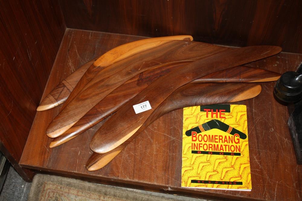 SIX AUSTRALIAN ABORIGINAL WOODEN BOOMERANGS TOGETHER WITH A BOOMERANG INFORMATION BOOK