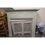 A PAINTED FIRE SURROUND AND TWO RADIATOR COVERS (3)