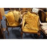 A PAIR OF WALNUT UPHOLSTERED TUB STYLE ARMCHAIRS (2)