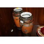 A PAIR OF ORIENTAL STYLE VASES DECORATED WITH DRAGONS AND BIRDS