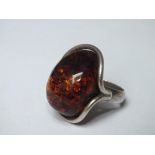 A LARGE SIZE SILVER & AMBER RING