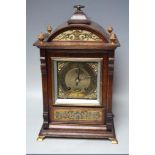 AN EARLY 20TH CENTURY OAK CASED MANTEL CLOCK BY LENZKIRCH, the architectural case with decorative