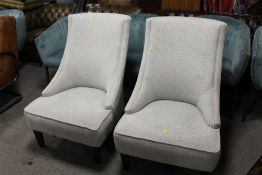 A MODERN PAIR OF UPHOLSTERED CHAIRS