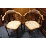 A PAIR OF ANTIQUE CARVED MAHOGANY CORNER CHAIRS