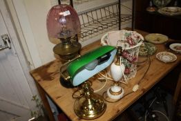 A CONVERTED OIL LAMP WITH PINK GLASS SHADE A/F TOGETHER WITH A MODERN BANKERS LAMP PLUS ANOTHER (3)