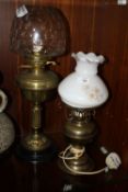 A VINTAGE OIL LAMP WITH GLASS SHADE, TOGETHER WITH A CONVERTED OIL LAMP (2)