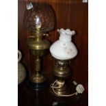 A VINTAGE OIL LAMP WITH GLASS SHADE, TOGETHER WITH A CONVERTED OIL LAMP (2)