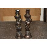 A PAIR OF LARGE COPPER EFFECT FIGURATIVE CANDLESTICKS