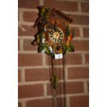 A VINTAGE WOODEN CUCKOO CLOCK & WEIGHTS