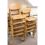 A COLLECTION OF NINE RETRO STACKING CHAIRS