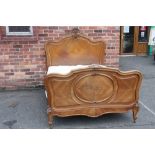 AN ANTIQUE 19TH CENTURY FRENCH WALNUT BED FRAME, with typical Rococo carved detail, with mattress, W