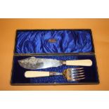 A CASED SET OF ANTIQUE FISH SERVERS