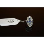 A SAPPHIRE AND DIAMOND RING, set with ten brilliant cut diamonds and five sapphires, hallmarks