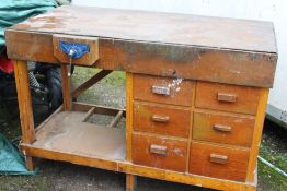 A LARGE WOODEN WORK BENCH A/F