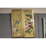 A PAIR OF GILT FRAMED AND GLAZED ORIENTAL PAINTINGS ON SILK DEPICTING BIRDS
