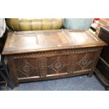 AN ANTIQUE OAK CARVED PANELED COFFER W-124 CM