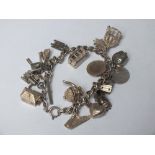 AN VINTAGE SILVER CHARM BRACELET