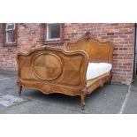 AN ANTIQUE 19TH CENTURY FRENCH WALNUT BED FRAME, with typical Rococo carved detail, with mattress, W