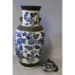 A LARGE ORIENTAL CRACKLE GLAZE BALUSTER TEMPLE VASE AND COVER WITH CHARACTER MARK TO BASE, the