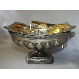 A HALLMARKED RUSSIAN SILVER SWING HANDLED BASKET, stamped to the gilded bowl, handle and the base,