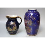 A VINTAGE CROWN DEVON CREAM JUG, blue ground with gilded decoration of an Oriental garden, H 14