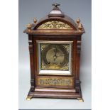 AN EARLY 20TH CENTURY OAK CASED MANTEL CLOCK BY LENZKIRCH, the architectural case with decorative