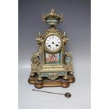 A 19TH CENTURY GILT METAL AND PORCELAIN FRENCH MANTEL CLOCK, of classical outline with urn finial,