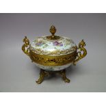 A GILT AND PORCELAIN POT POURRI /LIDDED TRINKET, the circular porcelain body with hand painted