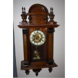 AN ANTIQUE WALNUT CASED VIENNA WALLCLOCK OF SMALL PROPORTIONS, the case decorated with painted